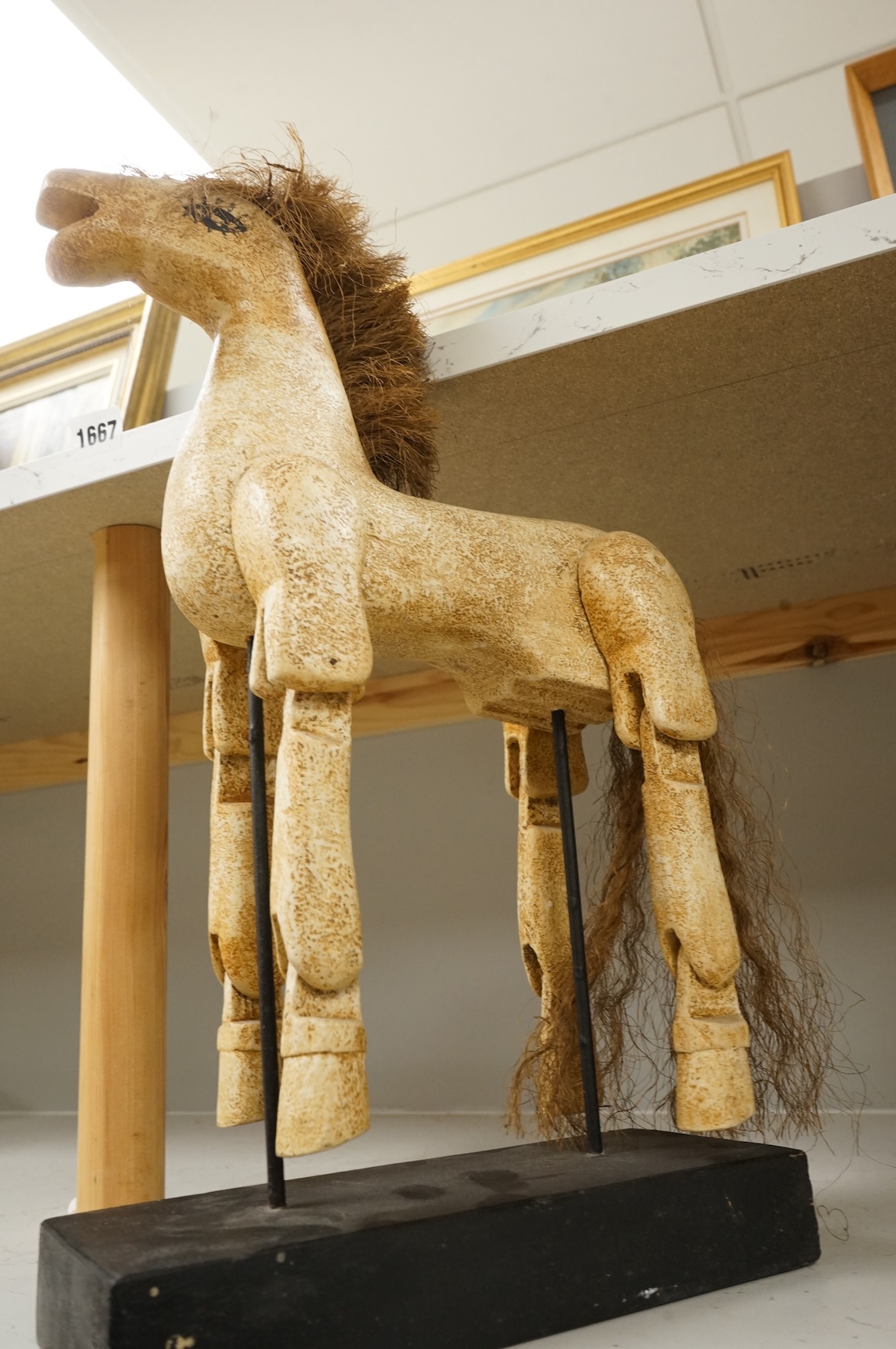 A painted composition articulated model horse, on stand, 42cm